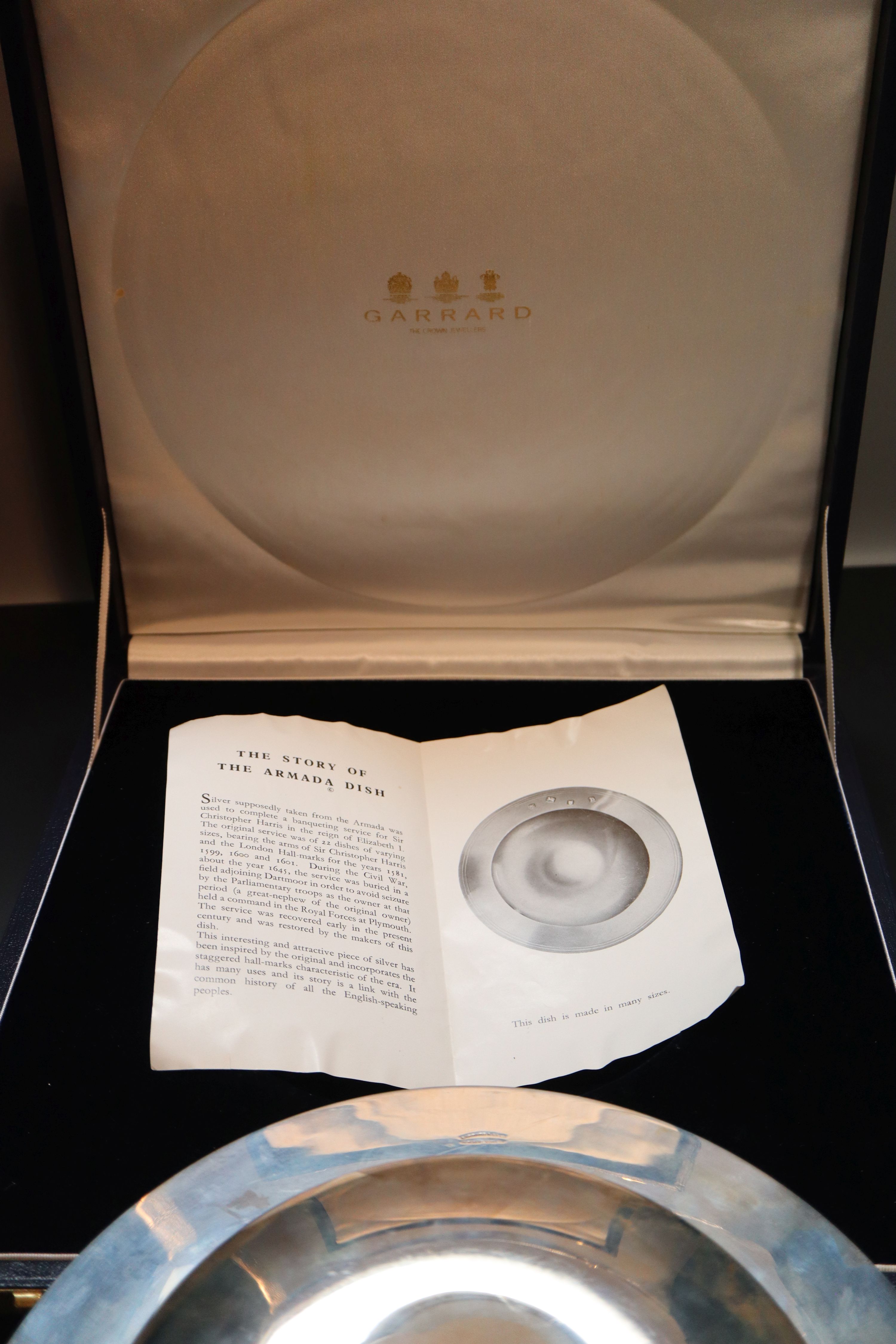 A cased modern silver Armada dish, 29.3cm, 34.5oz, in Garrards presentation case.